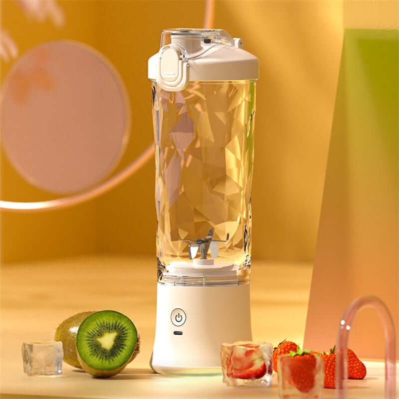 Mini Blender featuring a unique six-blade design for making smoothies, placed on a colorful countertop with fruits.